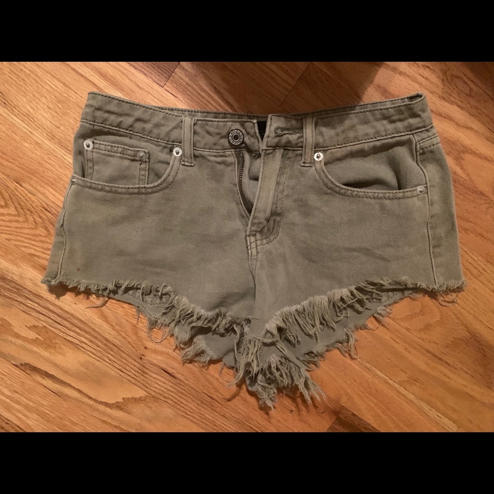 Cheeky cut green frayed shorts